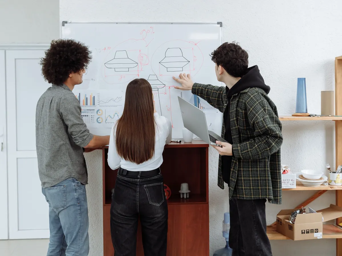 A team mapping ideas on a whiteboard