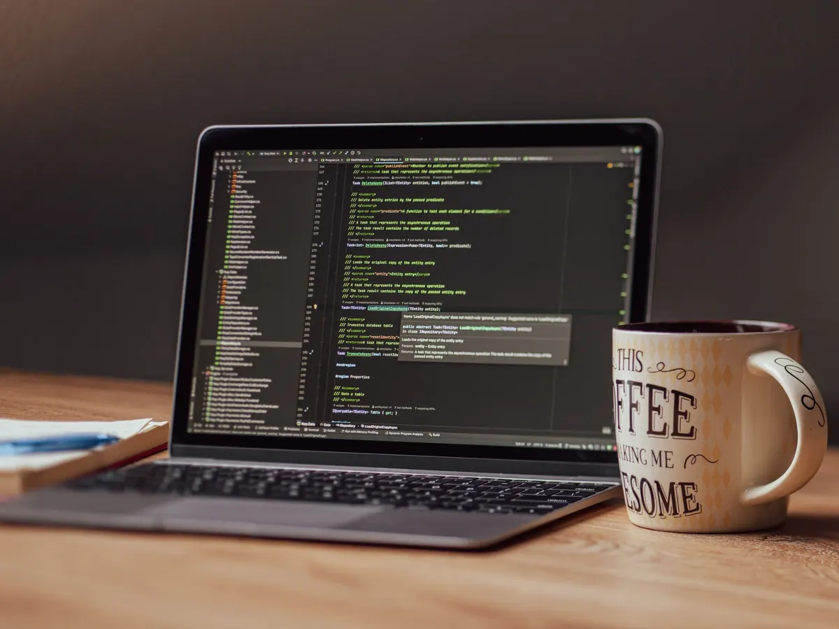 A starter project open in a code editor beside a coffee mug