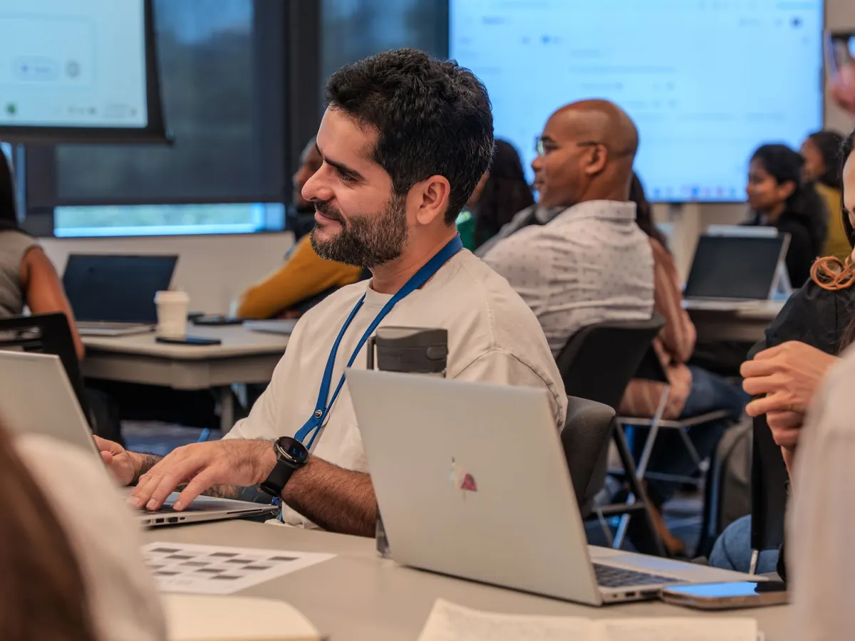 A team in a hands-on session with laptops